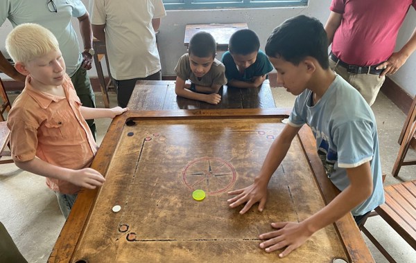 Nepal Boys Playing Board Game In Gyan Chakshu School