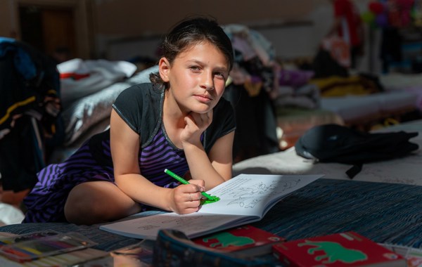 Credit Paul Wu:Redd Barna Olesia, 10, Drawing On Her Bed In The School Gym Credit